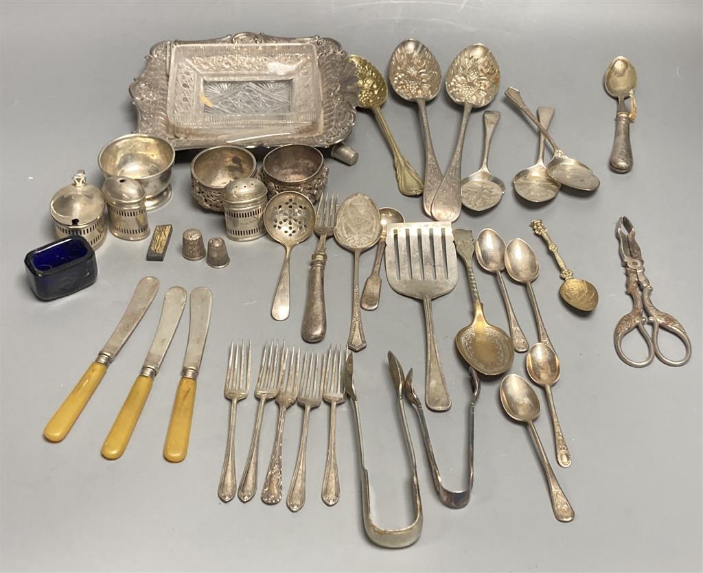 Four silver condiments, two silver thimbles, two Indian? salts and assorted plated flatware etc.